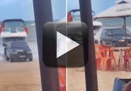 Fiat Uno aparece rebocando lancha na praia